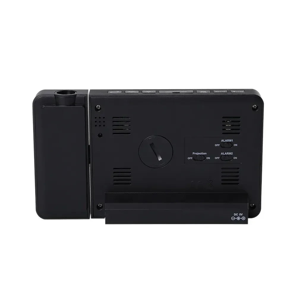 Rear view of black digital projection alarm clock with adjustable time dial and alarm switches