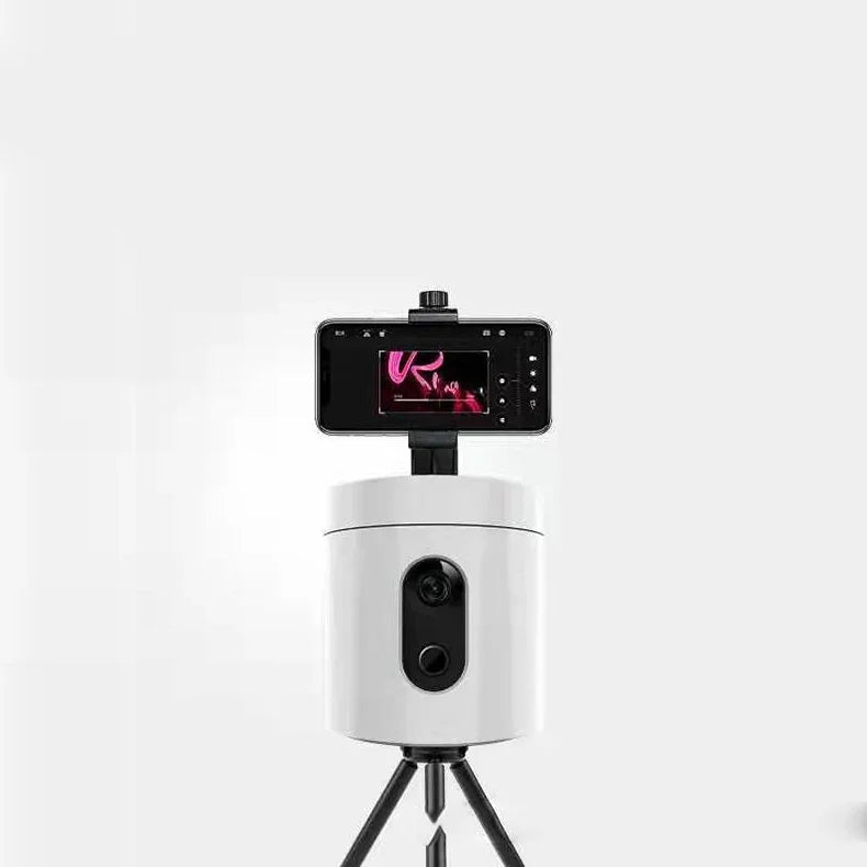 Smart auto-tracking camera mount with attached smartphone on tripod for video recording