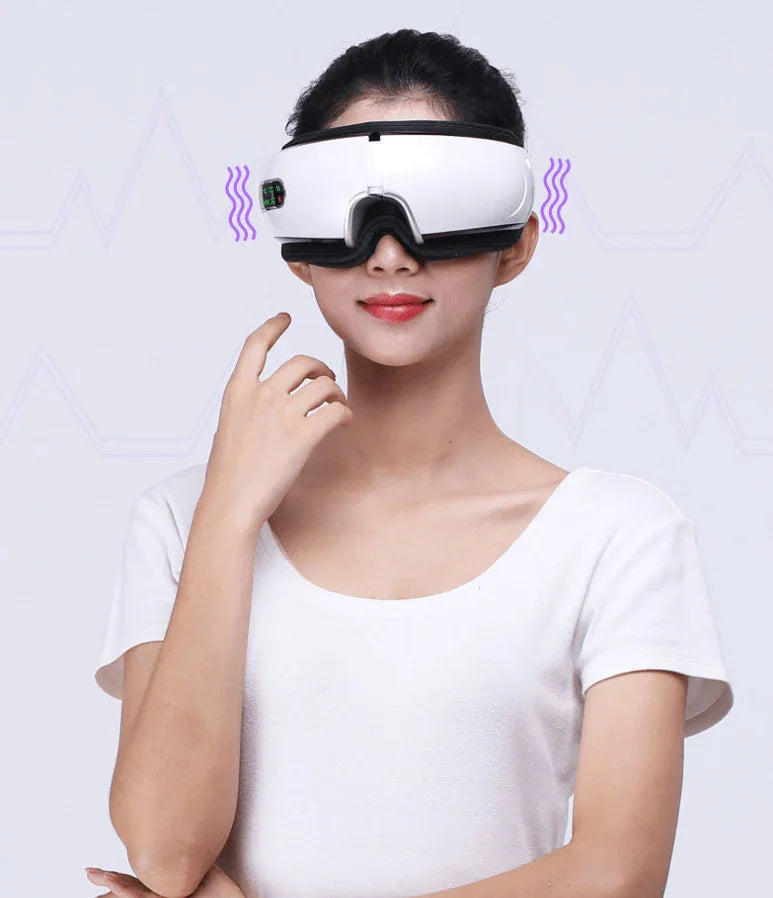 Woman wearing smart eye massager device, white background, wellness gadget