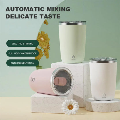 Electric self-stirring cups in pastel colors, waterproof, with power buttons, on marble stands.