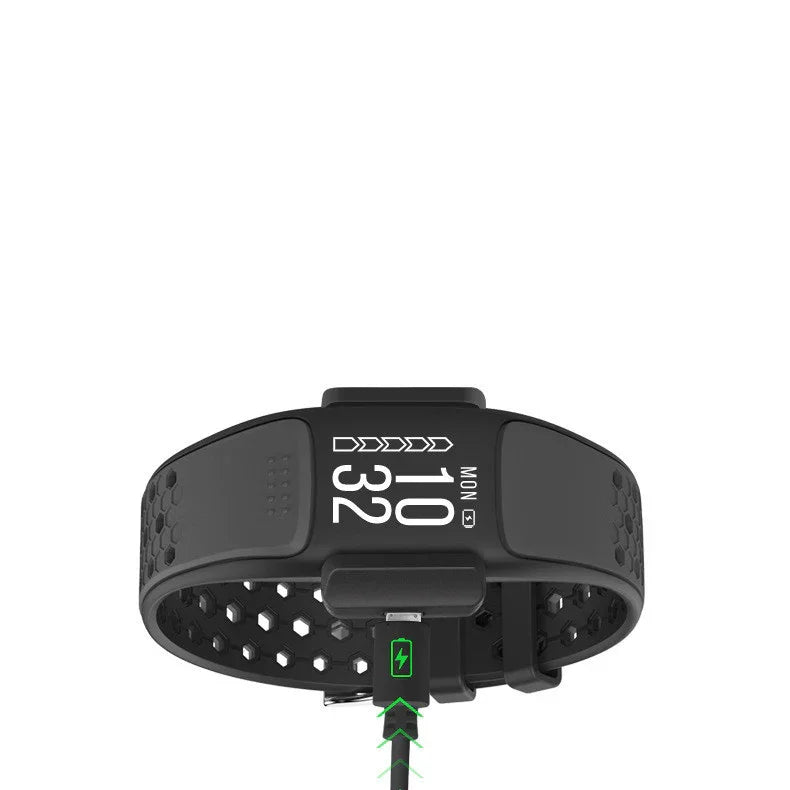 Black smart fitness tracker wristband with digital display and charging cable
