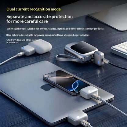 Smartgizmoshop auto disconnect charging protectors charging a laptop, phone, and earbuds.
