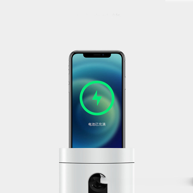 Smartphone on wireless charging station with full battery indicator, minimalist background