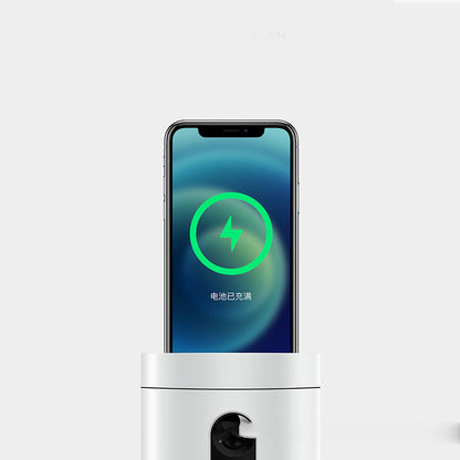 Smartphone on wireless charging station with full battery indicator, minimalist background