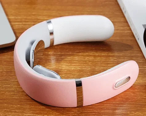 Pink and white smart neck massager with control button on wooden desk