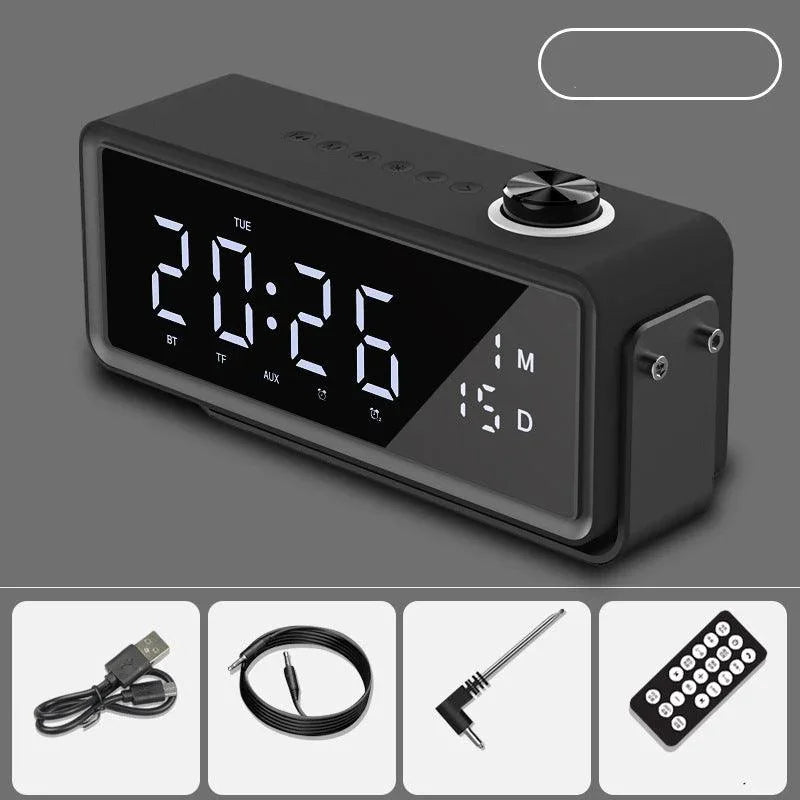 Black digital alarm clock with large LED display, date, Bluetooth, and included USB cable, AUX cord, antenna, and remote control