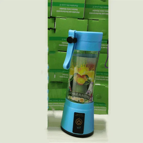 Blue portable electric blender with fruit design, push start button, and handle on white surface