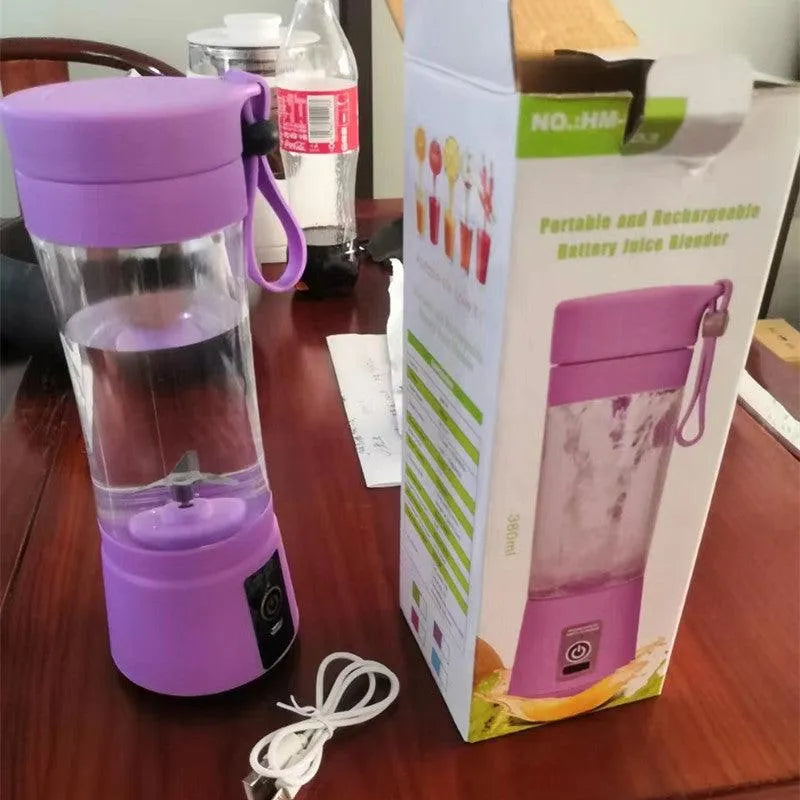 Portable purple rechargeable battery juice blender with USB charging cable on wooden table next to product box